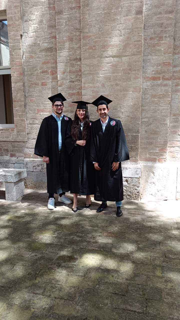 Me in academic regalia at my PhD graduation ceremony at the University of Perugia, June 2024